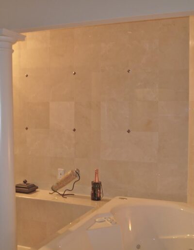 An elegant bathroom featuring a jacuzzi tub, a walk-in shower, and a fireplace.